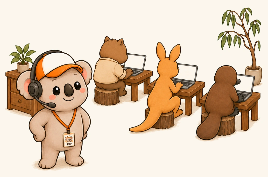 Kip in a headset in front of a wombat, a kangaroo and a platypus working at laptops on tree-stump stools.